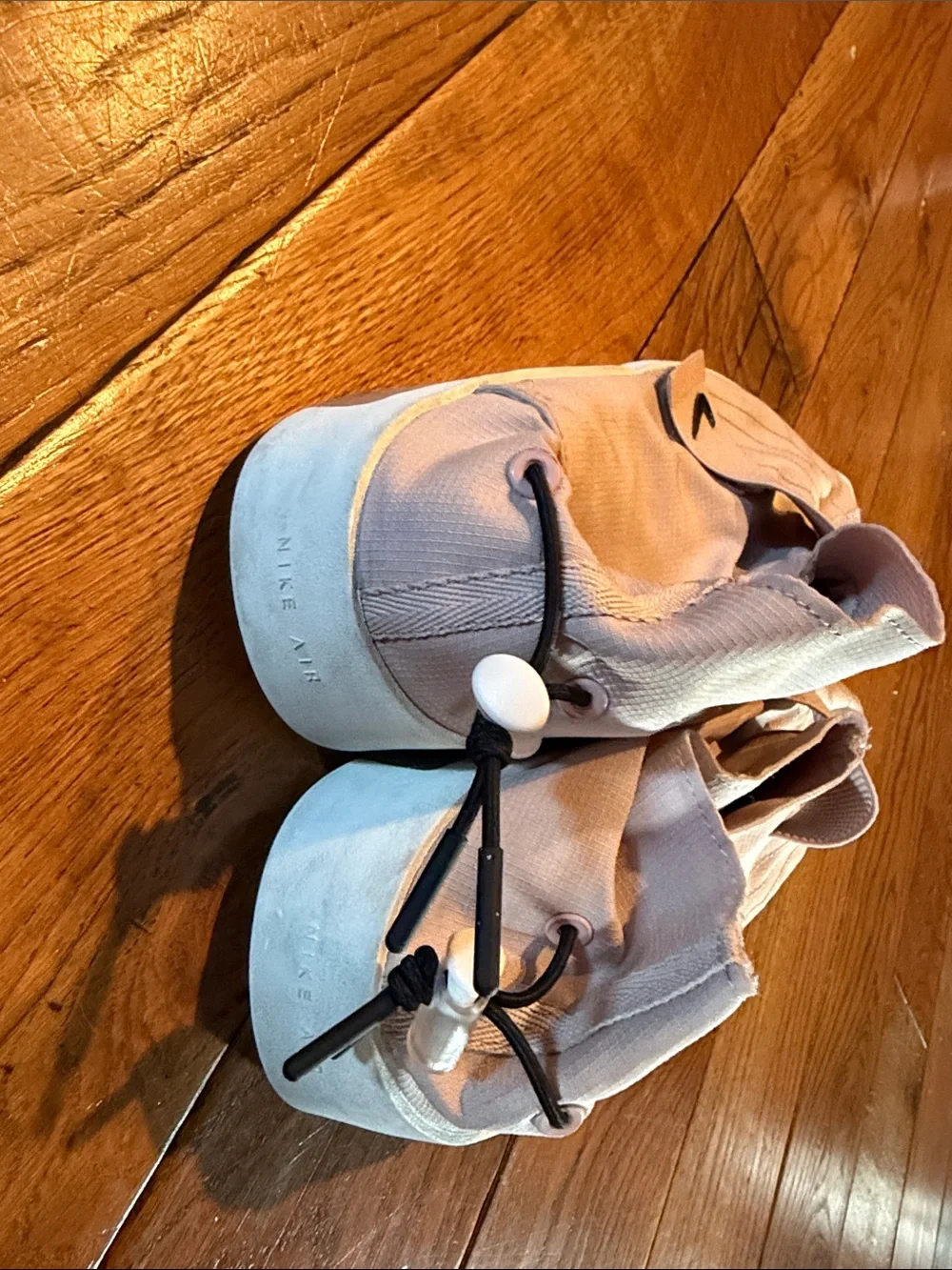 Nike Men’s Slip-On Training Shoes in Pale Pink with Black Swoosh